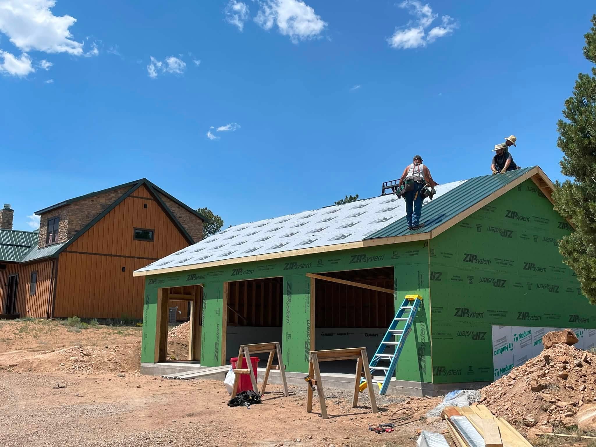 Simpson garage addition — ZIP System sheathing and R-Panel metal roof going on